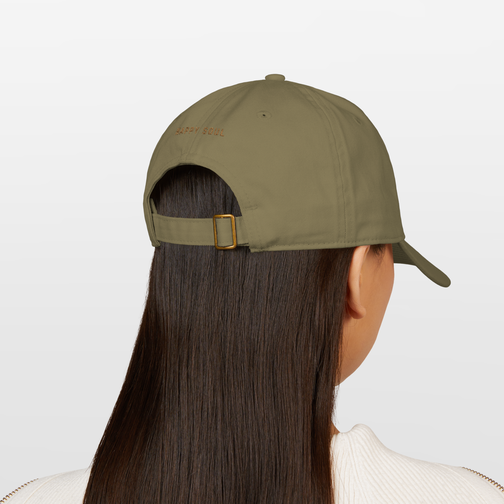 fashion cap spiritually designed to protect aura and crown chakra, innovative spiritual concept and fashion minimalist style, a model standing back view wearing the baseball cap the saying ' happy soul' on the back unisex style hat organic cotton premium quality 
