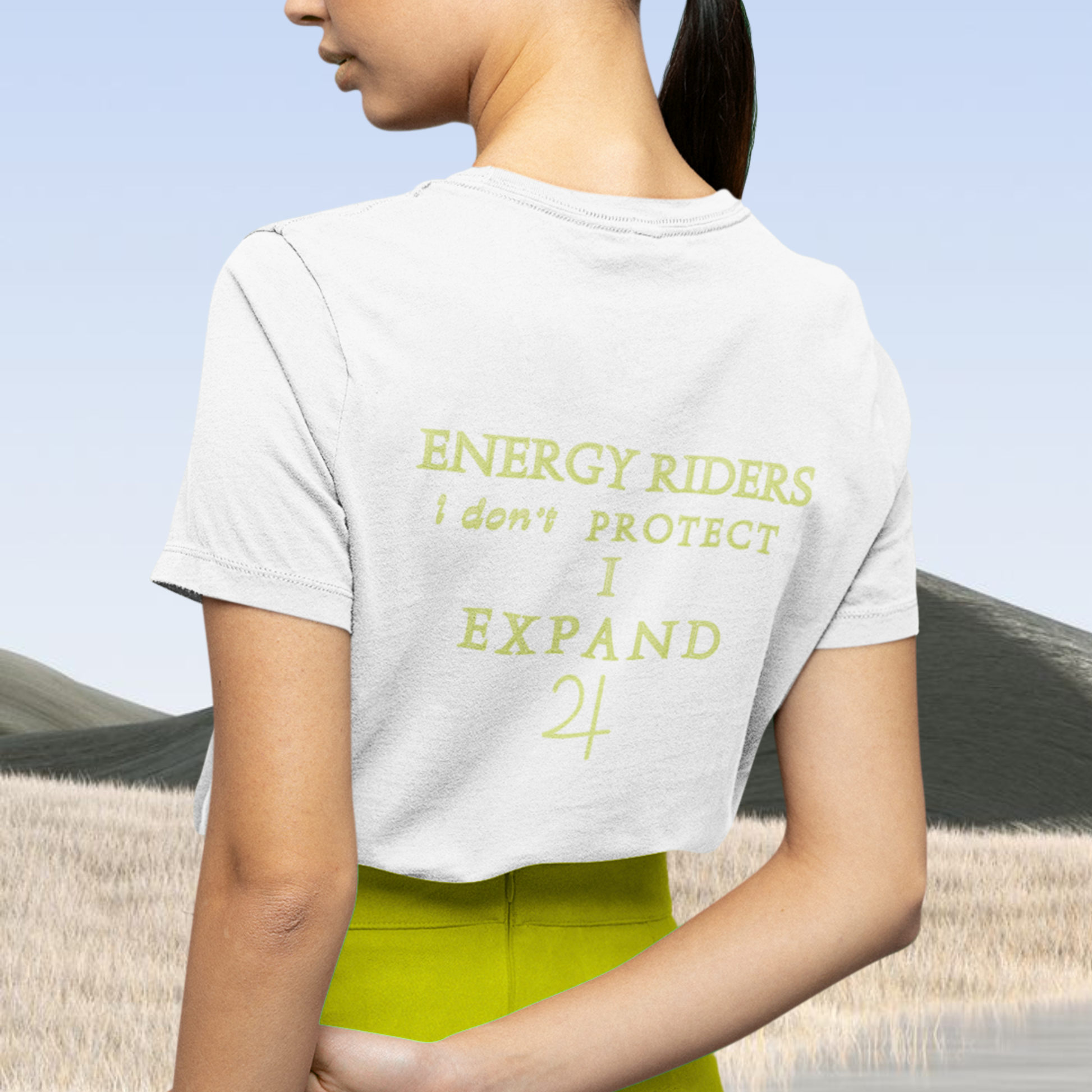 Spiritual clothing energy infused intentional fashion to wear, innovative concept clothes the photo represent a white t-shirt organic cotton with the saying ' energy riders i don't protect i expand' with the jupiter symbol in yellow green tone minimalist style unisex tee for spiritual and fashion people
